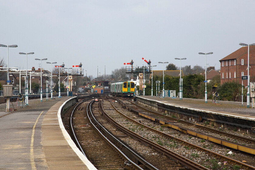 313213, SN 15.39 Bognor Regis-Barnham, Bognor Regis station 
 A fine scene at Bognor Regis sees four up starter signals at the platform ends controlled by an equally fine sixty-six lever Southern Type 13 signal box. The box dates from 1938 and was built in the Art Deco style that was very 'on-trend' just pre-war. 313213 is seen leaving Bognor station with the 15.39 shuttle service to Barnham. 
 Keywords: 313213 15.39 Bognor Regis-Barnham Bognor Regis station Southern