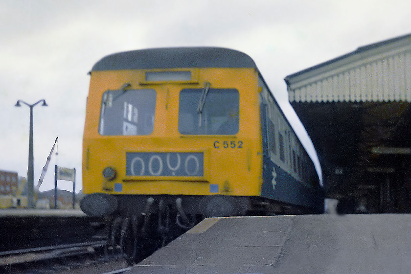 C552, unidentified Cardiff Central-Weymouth working, Westbury station 
 A three-car class 120 Swindon built cross-country DMU leaves Westbury with a service from Cardiff Central to Weymouth. This particular unit, C552, was composed of W51573, W59285 and W51582. I always thought that these units looked a little incongruous with their full-sized four character headcode boxes. They looked better when the boxes were plated over and they had line of three marker lights. 
 Keywords: C552 class 120 DMU Westbury station