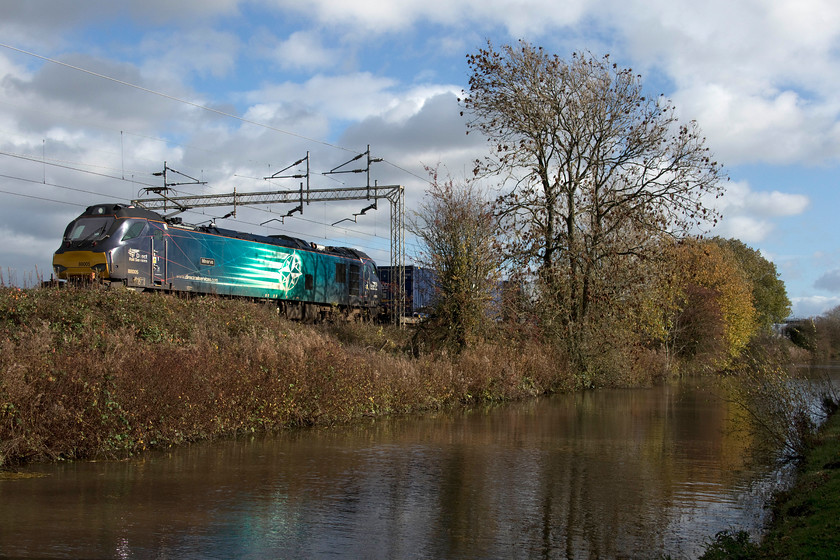 88005, 12.16 DIRFT-Mossend (4S44, 2L), Stretton Wharf SP432810 
 With the Oxford Canal (Oxford to Bedworth, seventy-eight miles in length) in the foreground 88005 'Minerva' heads the 4S44 12.16 Daventry to Mossend Freightliner. The train is seen passing Stretton Wharf near Brinklow in Warwickshire. After a run of wet days, the skies have cleared but the wind was still blowing hence the lack of a defined classic reflection in the waters of the canal. However, the quality of the 'clean' light made photography a pleasure. 
 Keywords: 88005 12.16 DIRFT-Mossend 4S44 Stretton Wharf SP432810 Minerva