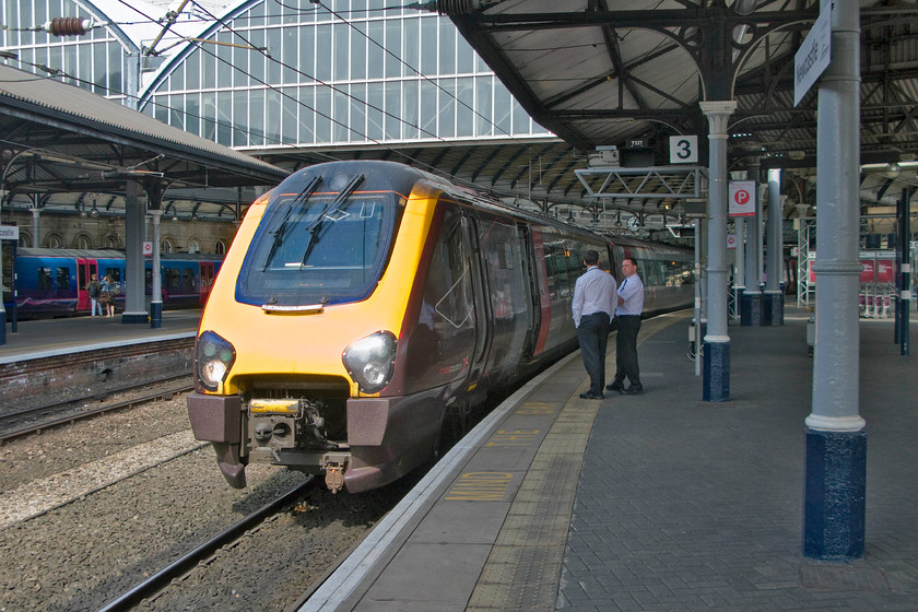 220005, XC 15.05 Newcastle-Reading (1V96), Newcastle station 
 According to the metadata recorded, the timecode for this photograph is 15.05. This means that the crew standing chatting on Newcastle's platform three will need to be aboard their train as it is due to depart as the 15.05 to Reading! I have said it before but I make no excuses for saying it again, I really would not want to make this journey aboard what is, after all, just a glorified dmu! 
 Keywords: 220005 15.05 Newcastle-Reading 1V96 Newcastle station Cross Country Voager