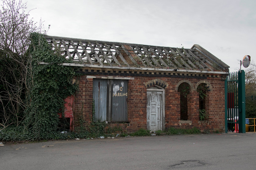 Former good yard office, Wellingborough station 
 This building is a remarkable survivor. All around it development has taken place but it stubbornly stays even if totally derelict! It was the old Wellingborough goods yard office and I suspect it also had the weigh-bridge in front of it but I have no evidence of this. It is situated at the far eastern end of Wellingborough's Midland Road just near the station car park. 
 Keywords: Former good yard office Wellingborough station