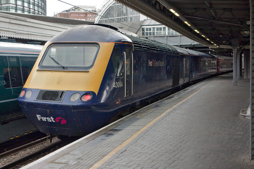 43094, 15.10 Old Oak Common HST Depot-London Paddington (5D47), London-Paddington station 
 43094 sits at the rear of the 15.10 Old Oak Common to Paddington ECS working having arrived at the London terminus. The HST was then due to work the 15.52 to Oxford, a relatively lowly working for an HST but for the passenger, a real step up from what they may have been used to in the past! There was a big typed notice in the cab of 43094 warning that it had poor batteries advising the drivers as to how to handle this situation; could this potential failure mean that this power car was the next candidate to be taken out of service? 
 Keywords: 43094 15.10 Old Oak Common HST Depot-London Paddington 5D47 London-Paddington station