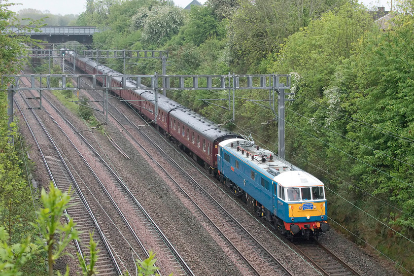 86259, outward leg of The Cumbrian Mountain Express, 07.10 London Euston-Carlisle (1Z86), Hyde Road bridge 
 86259 'Les Ross/Peter Pan' leads the outward leg of The Cumbrian Mountain Express running as its usual 1Z86. This left Euston an hour previously at 07.10 ending up at Carlisle. The veteran AC electric would give way to LMS Jubilee 56690 'Leander' at Carnforth. This was the first time that I have pictured this train from Hyde Road bridge in Roade as I was not sure if the whole train would fit in the shot between the two bridges, as can be seen, it does - just! 
 Keywords: 86259 The Cumbrian Mountain Express 07.10 London Euston-Carlisle 1Z86 Hyde Road bridge