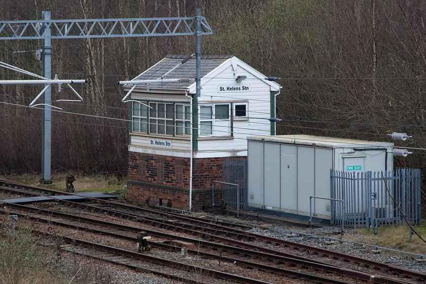 St. Helens Station Signal Box (LNWR, 1891) 
 Despite having had the Network Rail 'window and cladding' treatment, the basic framework of the 1891 LNWR signal box remains intact at St. Helens. This used to be a busy box as there was a number of nearby junctions and an extensive yard both in front and behind the box under what is now an area of trees. On a line that has been extensively updated in recent years I find it amazing that there still remains the odd throw back to the Victorian Railway (but I'm not complaining!). 
 Keywords: St. Helens Station Signal Box (LNWR, 1891)