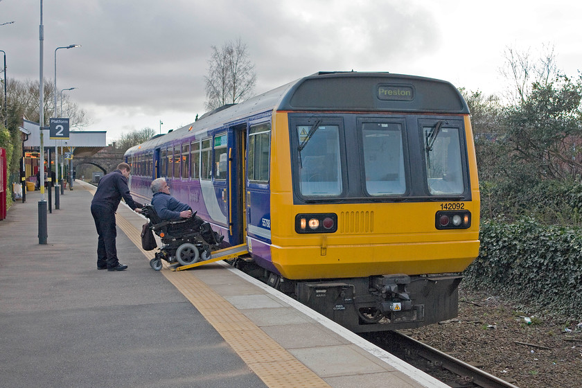 142092, NT 17.09 Ormskirk-Preston (2N07), Ormskirk station 
 The Pacers cannot be used after December 2019 due to their non-compliance with the Persons of Reduced Mobility Technical Specification for Interoperability (PRM-TSI) rules. Here is evidence of the problem as a customer has to helped on to the train using a ramp. Further more, once on the train, wheelchair customers are unable to access the toilets. 142092 will have to come out of service before the deadline, here it waits at Ormskirk station ready to work the 17.09 service to Preston. 
 Keywords: 142092 17.09 Ormskirk-Preston 2N07 Ormskirk station