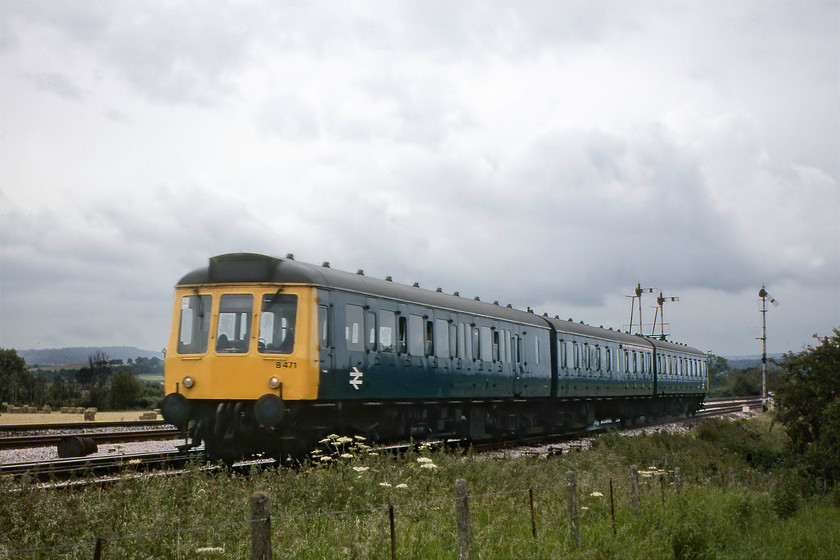 B471, 17.28 Taunton-Bristol Temple Meads, Cogload Junction (Courtesy of GGV) 
 The 17.28 Taunton to Bristol Temple Meads DMU local service has recently left its starting point and is seen passing Cogload Junction a few miles west of Taunton. This local working is composed of a Birmingham R. C. & W. Co. class 117 suburban DMU set B471 that should have been W51314, W59481, and W51329. This picture is courtesy of Graham Vincent who donated this slide to me as one of his 'rejects'; it's not too bad, it seems to me apart from a little motion blur! 
 Keywords: B471 17.28 Taunton-Bristol Temple Meads Cogload Junction