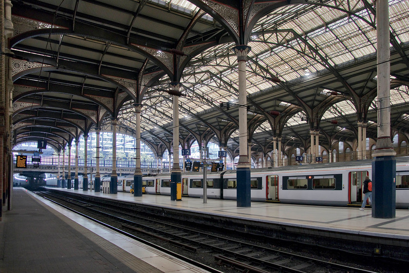 Interior, London Liverpool Street station 
 The grand interior of London Liverpool Street station taken from platform one. Whilst the station roof today looks very impressive by the 1970s it had become very dirty and structurally unsafe. BR proposed its complete removal and the rebuilding of the station probably utilising the brutalist concrete style of the time. However, thanks to a campaign led by the Poet Laureate, Sir John Betjemaman, a public enquiry was set-up and this resulted in a reprieve for the station in 1977 and it was comprehensively renovated at huge expense. Subsequent developments have kept it all intact and what a superb example of Victorian opulence and confidence it remains today! 
 Keywords: Interior London Liverpool Street station