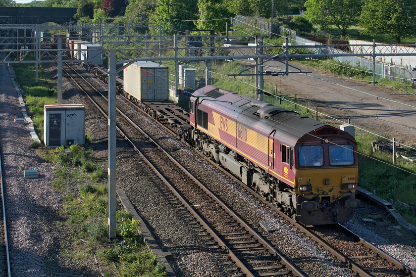 66110, 13.15 Trafford Park-London Gateway (4L56, 7E), site of Roade station 
 66110 yet again on the 4L56! For the third time in a week, I have captured this completely EWS liveried and branded locomotive on the 13.15 Trafford Park to London Gateway Freightliner. Indeed, last week I even caught it at the same location passing Roade even if it was from a different angle. See..... https://www.ontheupfast.com/p/21936chg/29025174004/x66110-13-15-trafford-park-london 
 Keywords: 66110 13.15 Trafford Park-London Gateway 4L56 site of Roade station