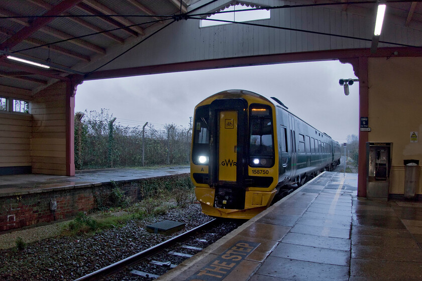 158750, GW 08.50 Weymouth-Gloucester (2V60, 8L) Frome station 
 In absolutely foul weather 158750 makes a welcome sight as it arrives at a wind-blown and cold Frome station. My wife and I travelled aboard the 2V60 08.50 Weymouth to Gloucester service as far as its destination. These units are a far more comfortable travelling experience than the more common Turbo units cascaded from the Thames Valley a few years ago following the introduction of the Electrostars. 
 Keywords: 158750 08.50 Weymouth-Gloucester 2V60 Frome station GWR Great Western Railway