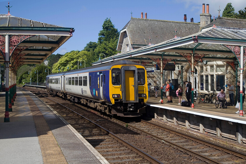 156488, NT 07.10 Carlisle-Lancaster (2C42, RT), Grange-over Sands station 
 The sun always seems to shine when I visit Grange-over-Sands! Today was no exception with 156488 arriving working the 07.10 Carlisle to Lancaster Northern service. Up until the end of April, there were no through trains east of Grange with buses ferrying passengers for a month to avoid a derailment of a six-car Class 195 caused by undermined track on the sea wall. For many in the local community, the closure reinforced the importance of the railway with the roads taking circuitous routes with them often narrow and congested. 
 Keywords: 156488 07.10 Carlisle-Lancaster 2C42 Grange-over Sands station Northern