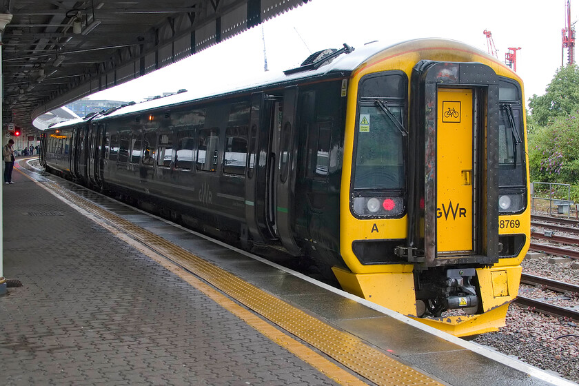 158769, GW 09.45 Bristol Temple Meads-Salisbury (2O07, RT), Bristol Temple Meads station 
 The weather on arrival at Bristol Temple Meads was awful being more like November than the middle of July and not like I remember it back in my spotting youth, see.... https://www.ontheupfast.com/p/21936chg/23615754604/basking-under-clear-blue-summer and this website's homepage. Sheltering under the canopy 158769 is seen about to work the 09.45 stopper service to Salisbury via Westbury. 
 Keywords: 158769 09.45 Bristol Temple Meads-Salisbury 2O07 Bristol Temple Meads station GWR Great Western Railway