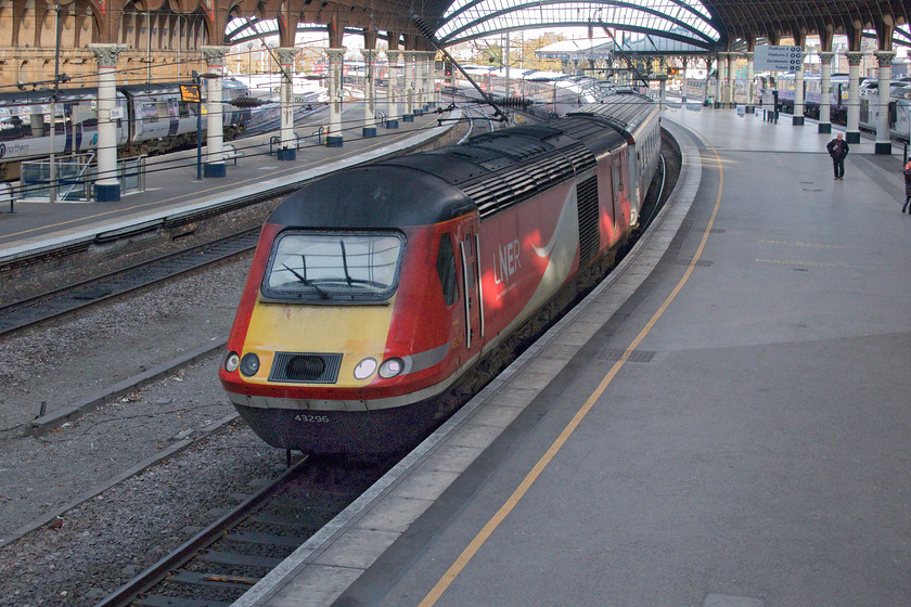 43296, VT 07.30 Edinburgh Waverley-London King`s Cross (1E05, 25L), York station 
 Taken from York's famous footbridge that spans the entire width of the station, 43296 leads the 07.30 Edinburgh to King's Cross hst service into the station. At a time when there are many Azumas in service, it's puzzling as to why a HST is still working this service. The front of the power car is looking a little tired but this is hardly surprising given that it is in its final month or so of service. 
 Keywords: 43296 07.30 Edinburgh Waverley-London King`s Cross 1E05 York station HST