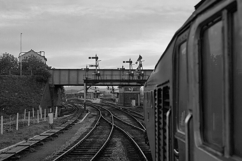 50044, 17.52 London Paddington-Westbury 1K68, Westbury North 
 On the final approach to Westbury station 50044 'Exeter' is seen leading the 17.52 from Paddington into its destination. In this view the magnificent gantry that spans all the lines and controls access to the station from the east is seen. Also visible is Westbury North signal box under the Station Road bridge. 
 Keywords: 50044 17.52 London Paddington-Westbury 1K68 Westbury North