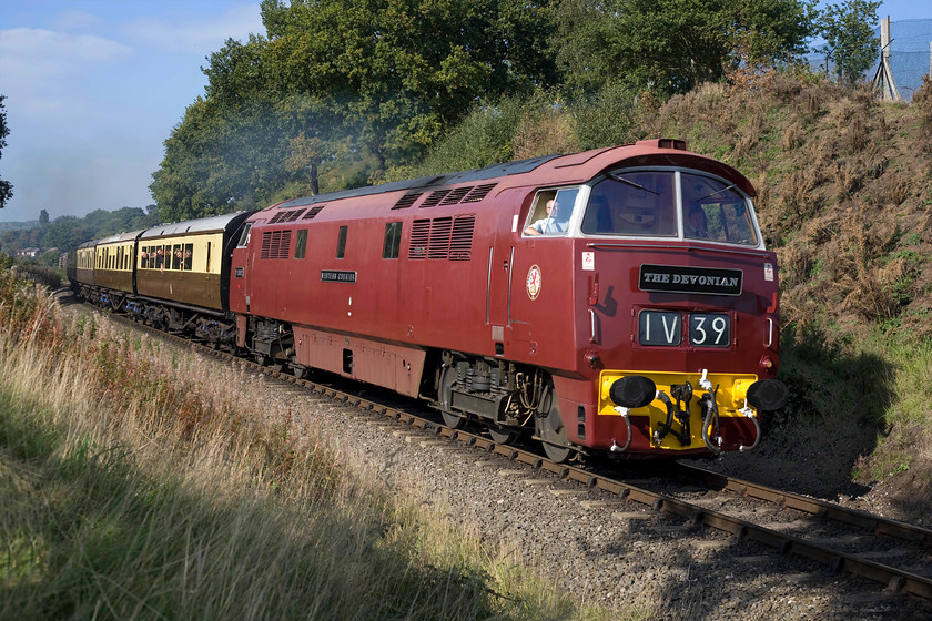 D1062, 13.32 Bewdley-Kidderminster, West Midlands Safari Park SO799748 
 Wearing a reproduction 'The Devonian' headboard D1062 'Western Courier' accelerates away from Bewdley with the 13.32 shuttle to Kidderminster hauling an authentic rake of GWR stock. The Severn Valley Railway holds a number of galas throughout the year with the three-day autumn diesel gala being extremely popular with enthusiasts as witnessed by the packed leading coach in this photograph!

There is an audio recording of this event on my youtube channel, see.... https://youtu.be/AUXuEyj6a3o 
 Keywords: D1062 13.32 Bewdley-Kidderminster West Midlands Safari Park SO79974 Western Courier The Devonian WESTERN LOCOMOTIVE ASSOCIATION WLA