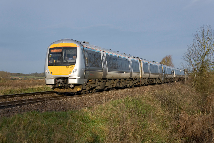 168329 & 168001, CH 08.15 Birmingham Moor Street-London Marylebone (1H12), King's Sutton 
 A pair of Chiltern units get a move on past King's Sutton working the 08.15 Birmingham Moor Street to Marylebone service. King's Sutton does not enjoy a particularly useful stopping pattern with most trains passing straight through much to the chagrin of the locals and the local user group who have been campaigning for more trains to serve the large village. 
 Keywords: 168329 168001 08.15 Birmingham Moor Street-London Marylebone 1H12 King's Sutton