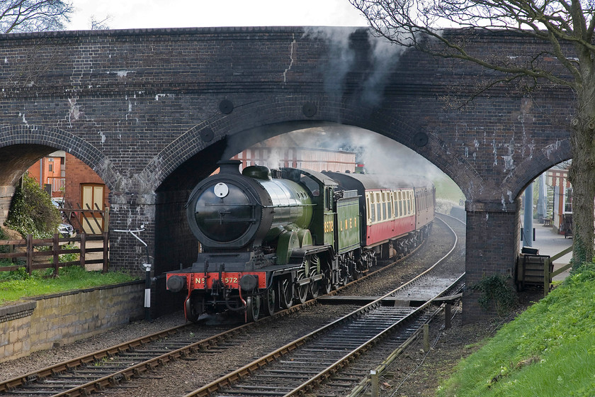 8572, 09.45 Sheringham-Holt, Weybourne station 
 The first Sheringham to Holt service of the day on the North Norfolk Railway runs wrong line at Weybourne. This is to facilitate the delivery of provisions and supplies to the station for the day. Former LNER B12 number 8572 stands under the road bridge to the west of the station with the 09.45 Sheringham to Holt train. 
 Keywords: 8572 09.45 Sheringham-Holt Weybourne station North Norfolk Railway LNER B12 4-6-0