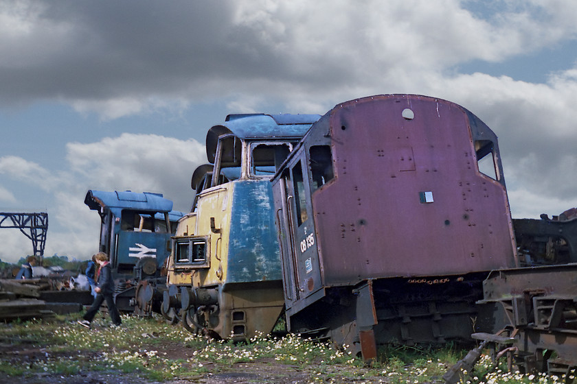 08008, D1063 & D1001, being cut up, Swindon Works 
 In the final stages of complete obliteration, 08008's cab, still in BR green livery, waits to be finished off! Behind the 08's cab are the cabs of D1063 'Western Monitor' and D1001 'Western Pathfinder'. Whilst nothing like the bizarre scenes recorded at Vic Berry's Leicester yard some years later, this picture does have a certain strange eeriness about it.