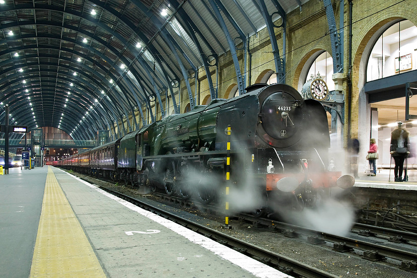 46233, return leg of The Lindum Fayre, 17.41 Lincoln-London King's Cross (1Z48), London King's Cross station 
 A relatively long exposure has been used at King's Cross to photograph 46233 'Duchess of Sutherland' that produces some interesting effects as the steam escapes from the locomotive. The Coronation Class has just arrived with the return Lindum Fayre charter as 1Z48 from Lincoln. The train crew will be working hard now to clean and tidy the stock as it prepares to leave empty to WCR's Southall depot. 
 Keywords: 46233 The Lindum Fayre 17.41 Lincoln-London King's Cross 1Z48 London King's Cross station Railway Touring Company RTC Duchess of Sutherland