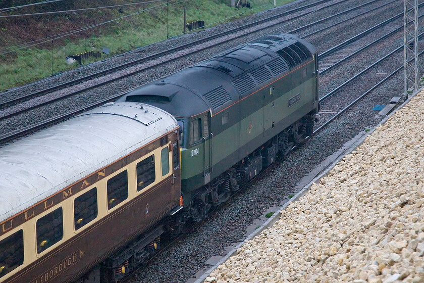 D1924, outward leg of The Great Western Envoy, 06.20 Rugby-Bristol TM (1Z40, 7L), Ashton Road bridge 
 Bringing up the rear of The Great Western Envoy Saphos charter as it passes Ashton Road bridge near Roade D1924 Crewe Diesel Depot is seen doing its best to camouflage itself! I was led to believe that the charter was to be top and tailed with a pair of Class 47s so was delighted that D213 headed the train with D1924 just going along for the ride! 
 Keywords: D1924 The Great Western Envoy, 06.20 Rugby-Bristol Temple Meads 1Z40 Ashton Road bridge Crewe Diesel Depot