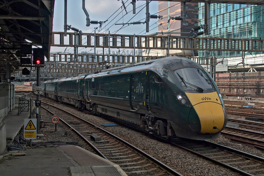 802017, GW 11.59 Cheltenham Spa-London Paddington (1L74, RT), London Paddington station 
 The 11.59 from Cheltenham arrives at Paddington bang on time being worked by 802017. It is about to stop at platform two and is viewed from an excellent vantage point on platform one. It is interesting how one's sense of direction plays tricks. It could rightly be assumed that trains leaving from this end of Paddington are heading in a roughly south-westerly direction but a study of a map reveals that in this spot that they are actually heading northwest coming within half a kilometre of the WCML at Kensal Green before the lines head more of a due westerly! 
 Keywords: 802017 11.59 Cheltenham Spa-London Paddington 1L74 London Paddington station IET Great Western Railway GWR