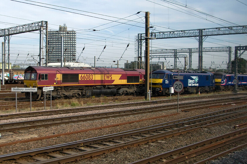 66083, 90034 & Class 90, stabled, Wembley Yard 
 A further three locomotives are seen stabled in Wembley Yard. 66083 is still wearing its EWS livery whilst 90034 is seen in the centre in its EWS livery. To the extreme right is another Class 90 unfortunately unidentified. It is one First Group's ScotRail locomotives dedicated to woking the sleeper services. 
 Keywords: 66083 90034 Class 90 stabled Wembley Yard