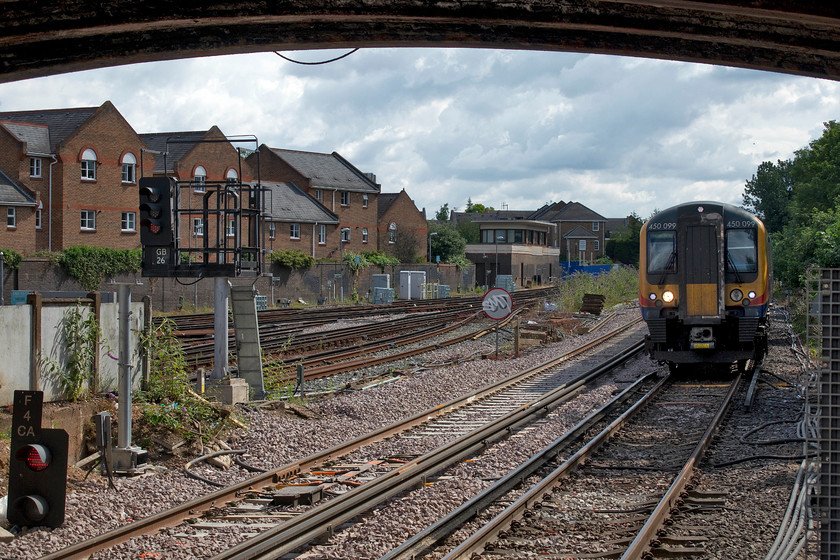 450099, SW 09.50 London Waterloo-Reading (2C23, 3L), Richmond station 
 Desiro 450099 arrives at Richmond about to pass under Church Road bridge forming the 09.50 Waterloo to Reading service. To the left in the middle distance is Richmond's super SR type 13 1940 signal box. It is still in use with an NX panel controlling the North London Line (and District Line) from Richmond to Bollo lane. 
 Keywords: 450099 09.50 London Waterloo-Reading 2C23 Richmond station