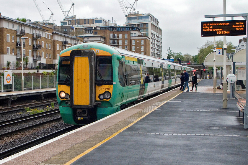 377210, SN 16.05 Clapham Junction-Watford Junction, Kensington Olympia station 
 The first of our two trains home from London to Milton Keynes arrives at Kensington Olympia. My wife son and I travelled aboard 377210 which was working the 16.05 Clapham Junction to Watford Junction. From Watford Junction we were able to then continue north with London Northwestern as is more usual. 
 Keywords: 377210 16.05 Clapham Junction-Watford Junction Kensington Olympia station