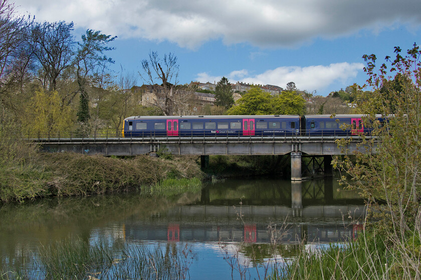 166202, GW 14.26 Westbury-Filton Abbey Wood (2D83, RT), Avon bridge Bradford-on-Avon 
 Whilst eating our picnic lunch at Bradford-on-Avon's Barton Farm I was able to photograph this passing train leaving the Wiltshire town's station. Still in its First Great Western livery turbo unit 166202 leaves with the 2D83 14.26 Westbury to Filton Abbey Wood stopper. It is crossing the River Avon with a pleasing reflection in the water below the bridge. 
 Keywords: 166202 14.26 Westbury-Filton Abbey Wood 2D83 Avon bridge Bradford-on-Avon Turbo First Great Western