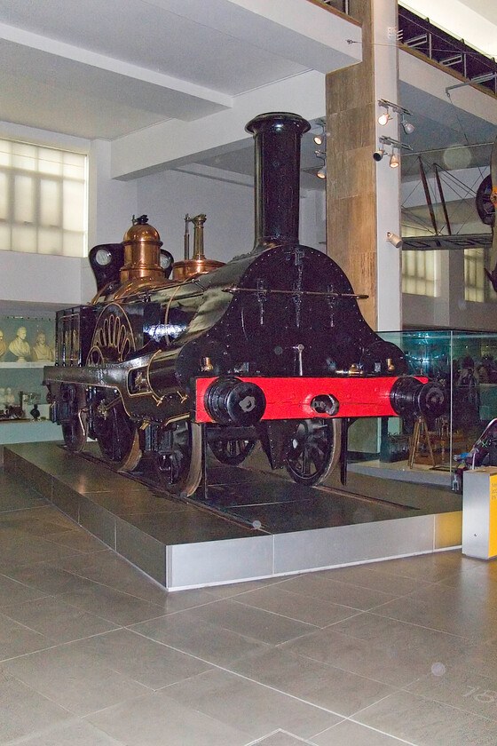 49 (1868), exhibit, Science Museum 
 Built for the Grand Junction Railway in 1845 and numbered 49 'Columbine' is an elegant and well-proportioned standard gauge locomotive. Later, after being taken over by the London and North Western Railway, it was renumbered 1868 and survived in operation until 1902 when it was put in long-term store at Crewe Works. It was initially an exhibit at the Clapham British Transport Museum before becoming part of the NRM's collection. It is seen here on display in the Science Museum in Kensington. 
 Keywords: 49 1868 Columbine exhibit Science Museum