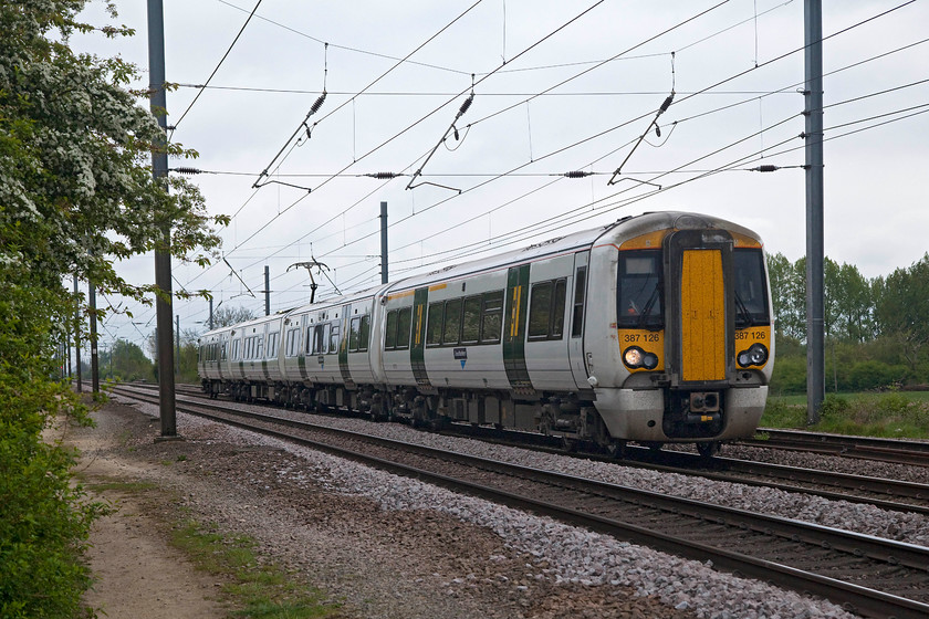 387126, GN 10.34 London Kings Cross-Peterborough (2P10, 2L), White House Crossing TL227777 
 387126 working the 10.34 London King's Cross to Peterborough working past White House Crossing about two miles north of Huntingdon. Whilst these units have Great Northern branding in the form of one vinyl per coach, they are still in Southern's livery and as such look a little incongruous on the ECML! 
 Keywords: 387126 2P10 White House Crossing TL227777