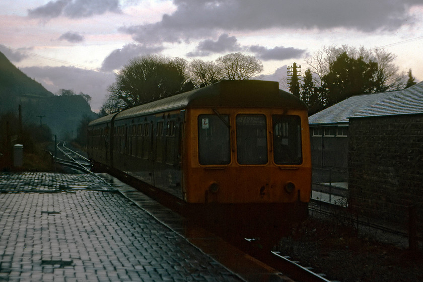 Class 108 DMU, unidentified Blaenau Ffestiniog working, Betws-y-Coed station 
 In the gathering gloom deep in the Conwy Valley, a class 108 DMU arrives with a service for Blaenau Ffestiniog. It is likely that this train will have originated from one of Llandudno or Llandudno Junction. The train is seen entering Betws-y-Coed station. 
 Keywords: Class 108 DMU Blaenau Ffestiniog working Betws-y-Coed station