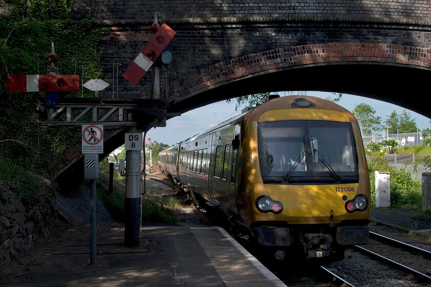 172006 & 172004, LN 16.41 Worcester Foregate Street-Dorridge (Cancelled from Birmingham Moore Street) (2C24, 55L), Droitwich Spa station 
 I have many photographs taken of Droitwich's down starter bracket with its pair of superb centre pivot splitting signals. In this photograph, with the signals in deep shadow, 172006 and 172004 leave working the 16.41 Worcester Foregate Street to Dorridge service. Unfortunately, like so many trains passing up the 'dark side' via Kidderminster and Stourbridge, it was heavily delayed arriving at Moore Street an eye-watering fifty-five minutes late where it was promptly terminated. I hope that passengers were fed more information both on and off the train than we were on our outward journey. 
 Keywords: 172006 172004 16.41 Worcester Foregate Street-Dorridge Cancelled from Birmingham Moore Street 2C24 Droitwich Spa station West Midlands Railway