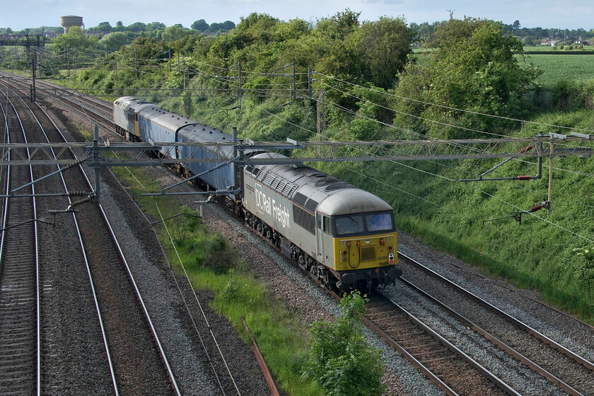 56091 & 56081, 17.00 Wembley Depot-Leicester LIP (5F90, 20E), Victoria bridge 
 I am not a particular fan of 'going away' photographs but when the subject is a Class 56 on the mainline it's got to be worth it! 56091 'Driver Wayne Gaskell the Godfather' sist dead in tow at the rear of the 17.00 Wembley Depot to Leicester LIP move transporting some barrier coaches back to UKRL Leicester depot. 
 Keywords: 56091 56081 17.00 Wembley Depot-Leicester LIP 5F90 Victoria bridge DCR Driver Wayne Gaskell the Godfather