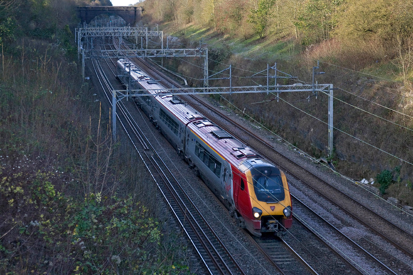 Class 221, 13.30 Birmingham New Street-London Euston (1B23), Hyde Road bridge 
 A Class 221 passes south through Roade working the 13.30 Birmingham to Euston Virgin service. The photograph is taken from the village's Hyde Road bridge located at the southern end of the mighty cutting. A diesel unit working under fuly energised wires from Birmingham to London - you explain that one to me please? 
 Keywords: Class 221 13.30 Birmingham New Street-London Euston 1B23 Hyde Road bridge