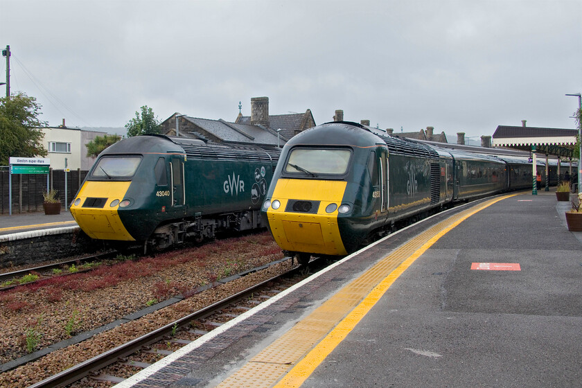 43153, GW 14.00 Cardiff Central-Penzance (2C70, 30L) & 43040, 15.13 Taunton-Cardiff Central (2U22, 2L), Weston-super-Mare station 
 Andy and I have just alighted from the HST Castle set to the right in this photograph being led by 43153 'Chn Castle'. We had a slightly delayed run down from Bristol on the 14.00 Cardiff to Penzance caused by the leading power car shutting down at Temple Meads. It was soon restarted again once a couple of fitters atteneded. The train never quite made up its time arriving some thirty minutes adrift at Penzance. To the left, the rear of the 15.11 Taunton to Cardiff Central service is seen with 43040 'Pomeroy Castle' powering. 
 Keywords: 43153 14.00 Cardiff Central-Penzance 2C70 43040 15.13 Taunton-Cardiff Central 2U22 Weston-super-Mare station Chn Castle Berry Pomeroy Castle