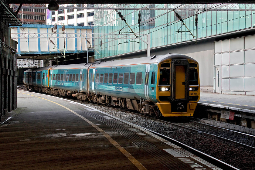 158835 & 150259, AW 07.15 Holyhead-Birmingham International (1G20, RT), Birmingham New Street station 
 Still in its ATW livery, 158835 and 150259 arrive at Birmingham New Street with the 07.15 Holyhead to Birmingham International. If I was making this journey from the far north-west of Wales, I would have chosen to travel in the relative comfort of the Class 158 leading the service rather than the rather antiquated 150 bringing up the rear! 
 Keywords: 158835 150259 07.15 Holyhead-Birmingham International 1G20 Birmingham New Street station Transport for Wales