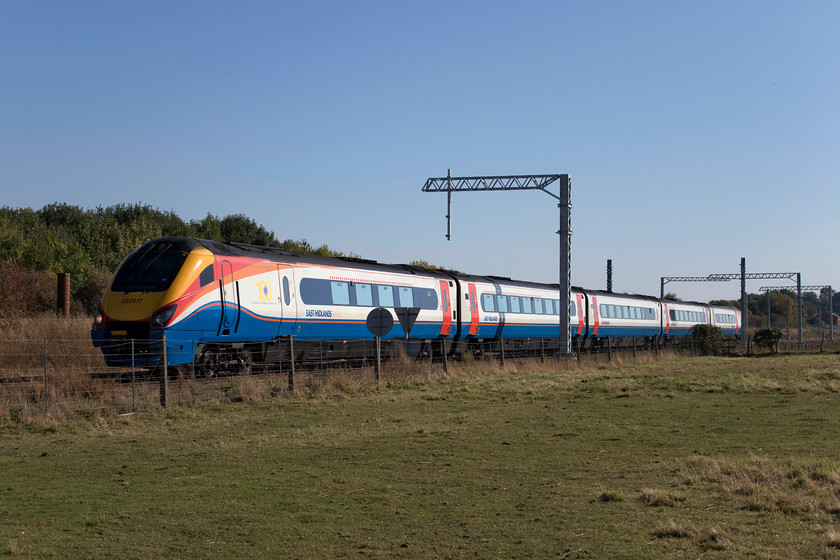 222017, EM 13.09 London St. Pancras-Nottingham (1D39, 2L), Irchester SP927667 
 222017 passes Irchester in Northamptonshire forming the 13.09 St. Pancras to Nottingham. The electrification masts are being installed at this location but in a somewhat random manner. After observing the haphazard and farcical nature of the GWML electrification I would like to think that the engineers would get the MML work done more efficiently? 
 Keywords: 222017 13.09 London St. Pancras-Nottingham 1D39 Irchester SP927667