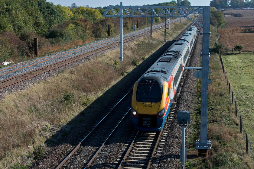 222008, EM 13.31 London St. Pancras-Sheffield (1F38, 2L), Irchester SP927667 
 222008 'Derby Etches Park' has descended from Sharnbrook Summit and is passing Irchester working the 13.31 St. Pancras to Sheffield. A little head-on and not lit perfectly but taken to show the engineering works taking place. The up relief line has been reinstated and the pilings are in ready to be sunk and the masts attached. The picture is taken from the new footbridge that was built a couple of years ago. 
 Keywords: 222008 13.31 London St. Pancras-Sheffield 1F38 Irchester SP927667