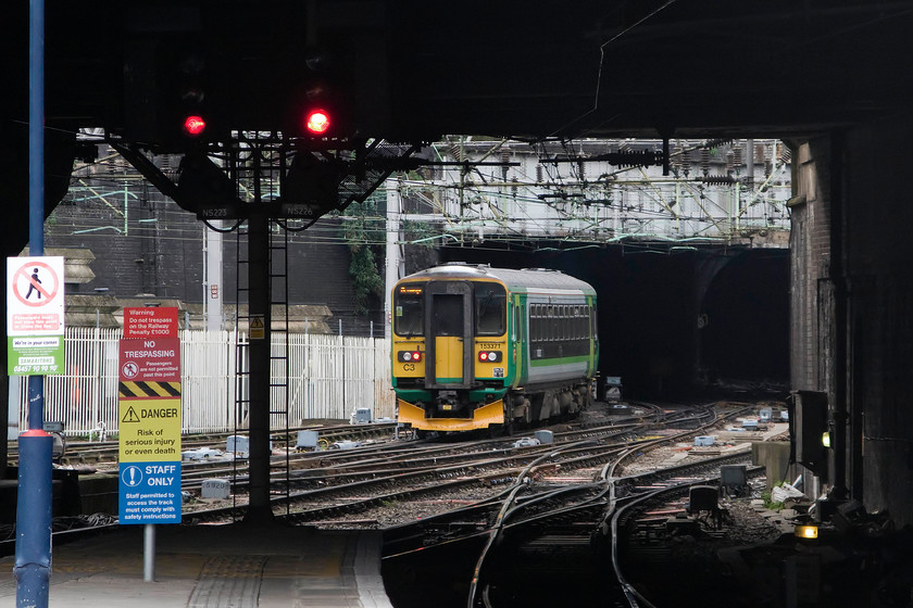 153371, LM 15.49 Birmingham New Street-Hereford (1V30), Birmingham New Street station 
 A photograph that typifies the environment at Birmingham New Street. Its subterranean location means that all trains enter through tunnels with only glimpses of daylight at either end of the station platforms. In this image, one of London Midland's ten Super Sprinter single-car units leaves New Street with the 1V30 15.49 to Hereford. Notice the myriad of signage on the platform end. Psychological research has found that a haphazard collection of notices such as this is totally ineffective. One sign in one colour passing on a simple message is all that is needed. 
 Keywords: 153371 15.49 Birmingham New Street-Hereford 1V30 Birmingham New Street station supper sprinter London Midland