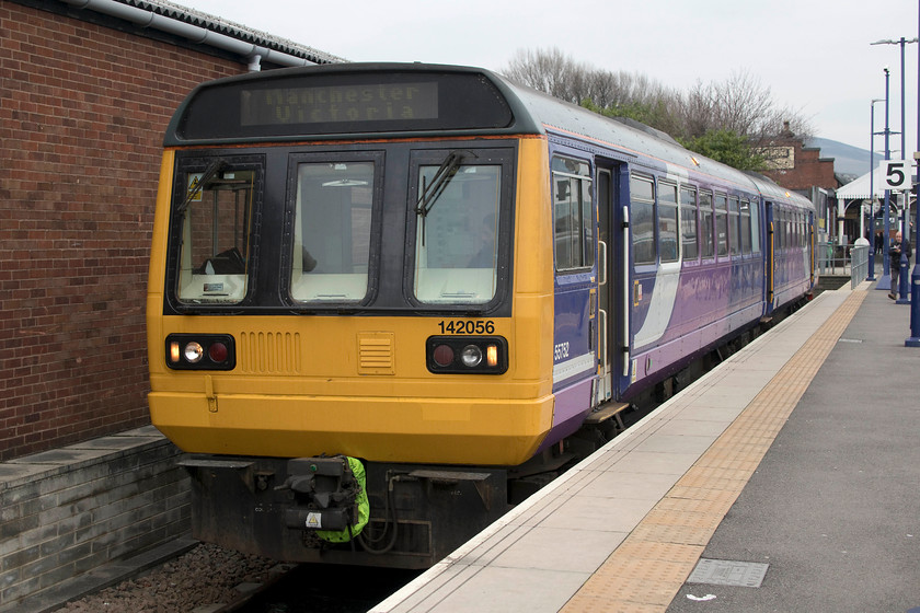 142056, NT 12.00 Stalybridge-Manchester Victoria (2J96, 1E), Stalybridge station 
 A scene soon to be confined to the history books! Entering its final year of operation, 142056 was delivered new in 1986 and was part of the second batch of fifty ordered by BR and it has been operating in the north west throughout its whole life. It is seen here about to leave Stalybridge's bay platform five with the 12.00 to Manchester Victoria. 
 Keywords: 142056 12.00 Stalybridge-Manchester Victoria 2J96 Stalybridge station