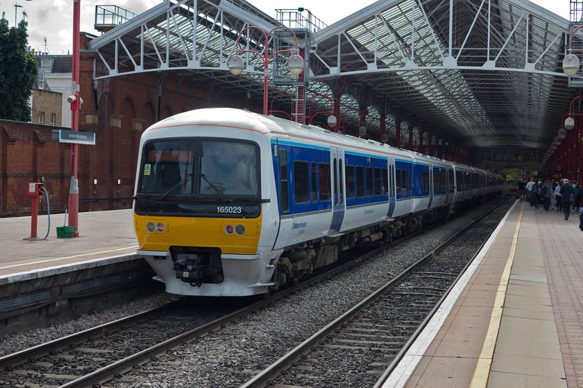 165023, CH 11.37 London Marylebone-Birmingham Moor Street (1R27, 2L), London Marylebone station 
 Sitting at platform two of Marylebone station, 165023 waits to work it next train, the 11.37 to Birmingham Moor Street. For a station that stared closure in the face during the early 1980s Marylebone is now very busy and essential part of the London commuter infrastructure. 
 Keywords: 165023 1R27 London Marylebone station