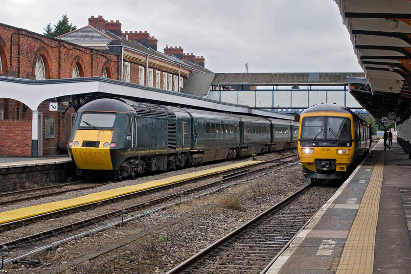 43122, 09.50 Laira TMD-Kidderminster SVR (5Z43, 32E) & 165136, GW 13.52 Worcester Foregate Street-Bristol Temple Meads (2T46, 10L), Worcester Shrub Hill 
 A scene not seen at Worcester for some years finds an HST next to a Turbo unit. The 5Z63 09.50 Laira to Kidderminster SVR empty stock move passes through the station with 43122, formally named 'Dunster Castle' bringing up the rear. Devoid of all branding the off-lease HST is heading to the Severn Valley Railway for its upcoming autumn diesel gala captured ther by Martin Loader, see... http://www.hondawanderer.com/43122_Kidderminster_2024.htm. To the right, 165136 is ready to leave with the 13.52 Worcester Foregate Street to Bristol service. 
 Keywords: 43122 09.50 Laira TMD-Kidderminster SVR 5Z43 165136 13.52 Worcester Foregate Street-Bristol Temple Meads 2T46 Worcester Shrub Hill GWR HST Dunster Castle