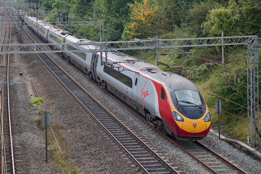 390134, VT 11.20 London Euston-Manchester Piccadilly (1H07, 3L), Victoria Bridge 
 390134 'City of Carlisle' passes Victoria Bridge just south of Roade on the WCML working the Sunday 11.20 Euston to Manchester Piccadilly. 
 Keywords: 390134 1H07 Victoria Bridge