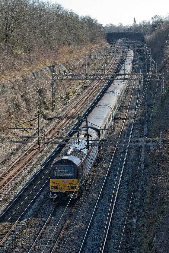 67006, 11.01 Liverpool South Parkway-Wembley Central footex (1Z22, 11E), Roade cutting 
 67006 'Royal Sovereign' brings up the rear of the 11.01 Liverpool South Parkway to Wembley Central footex charter as it passes through Roade cutting. Whilst the train was being led by a smart-looking 90039 the Class 67 was powered and running which seemed odd unless it was providing some sort of power to the stock? Incidentally, the supporters aboard the train were to enjoy an 11-10 victory (on penalties) against Chelsea no doubt lapping up the atmosphere on the journey home in the evening drinking the buffet/bar dry! 
 Keywords: 67006 11.01 Liverpool South Parkway-Wembley Central footex 1Z22 Roade cutting Royal Sovereign