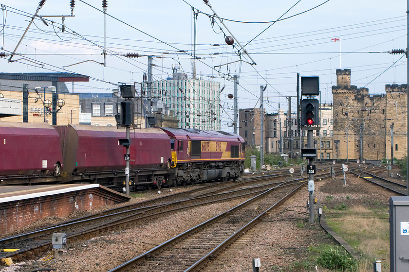 66075, 15.07 Tyne Yard-North Blyth, Newcastle station 
 66075 passes through Newcastle Central at the northern end of the station. It is leading the 15.07 Tyne Yard to North Blyth coal empties. With coal traffic on the decline due to a drop in national demand, the northeast remains an area where coal traffic can be seen on a regular basis even if it is dealing with imported coal. 
 Keywords: 66075 15.07 Tyne Yard-North Blyth Newcastle station coal train