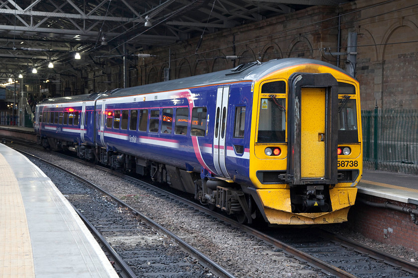 158738, SR 17.29 Tweedbank-Edinburgh Waverley (2T99), Edinburgh Waverley station 
 158738 awaits its next turn at Edinburgh Waverley station. It has just terminated having worked the 17.29 from Tweedbank. Notice the oversized numbers on the front of the unit, some seem to have this feature, whereas others are are the standard size. 
 Keywords: 158738 17.29 Tweedbank-Edinburgh Waverley 2T99 Edinburgh Waverley station