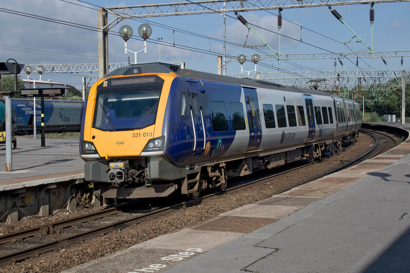 331013, NT 17.02 Manchester Victoria-Liverpool Lime Street (2F27, 1E), Edge Hill station 
 331013 approaches Edge Hill station working the 17.02 Manchester Victoria to Liverpool Lime Street service. Notice the customer information display to the left of the front of the train. These were installed at Edge Hill in January 2021. However, despite this modernisation work, step-free access is not available to two of the station's four platforms. 
 Keywords: 331013 17.02 Manchester Victoria-Liverpool Lime Street 2F27 Edge Hill station