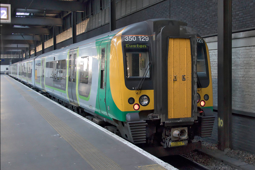 350129, LN 15.49 London Euston-Birmingham New Street (1W19, 6L), London Euston station 
 My train back from London to Northampton sits at Euston's platform eighteen. 350129 worked the 15.49 Euston to Birmingham New Street that was unpleasantly overcrowded as it was just a single set working. At least it arrived into Northampton on-time so my wife was able to give me and Bertie the Brompton a ride home to Roade! 
 Keywords: 350129 15.49 London Euston-Birmingham New Street 1W19 London Euston station