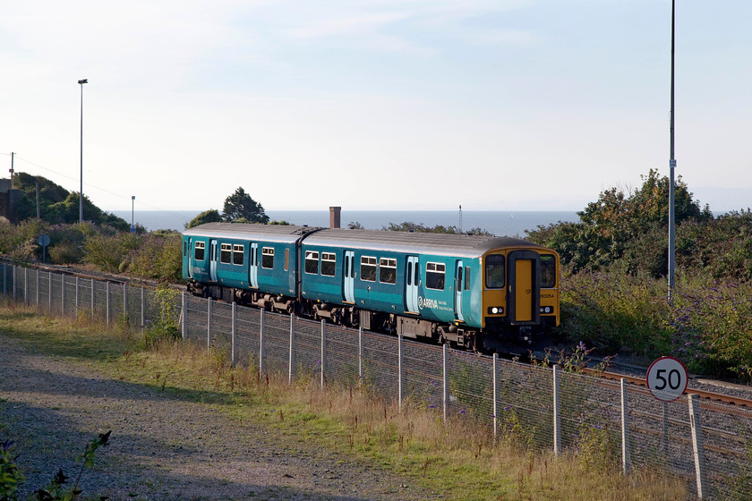 150254, AW 06.38 Merthyr Tydfil-Bridgend (2E08), Aberthaw 
 150254 skirts the Bristol Channel as it approaches Aberthaw. It is working the 06.38 Merthyr Tydfil to Bridgend service. This train completes a virtually complete circular route starting at about 200 metres above sea level, then descending down the Taff Vale to Cardiff. It then takes the Vale of Glamorgan coastal line, as seen here, back up to Bridgend. 
 Keywords: 150254 06.38 Merthyr Tydfil-Bridgend 2E08 Aberthaw