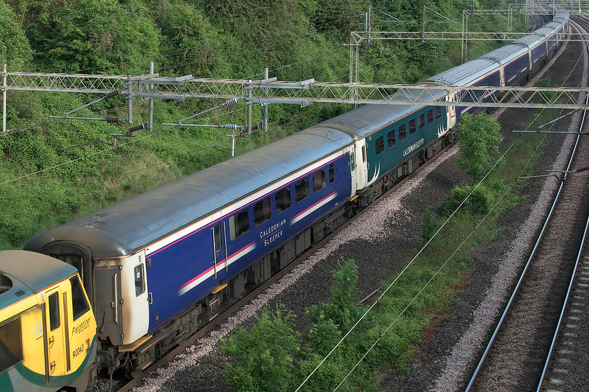 Stock, CS 19.50 Fort William, 21.43 Aberdeen, 20.45 Inverness-London Euston (1M16, 4E), Victoria bridge 
 At the time of writing, these two CS branded Mk. II coaches are almost the oldest in revenue earning service dating from the mid-1970s. They are scheduled for immediate withdrawal as their Mk. IV replacements are due to enter service from Monday 3rd June. The Mk. III sleeper coaches, also to be replaced, make up the rest of the train as it passes Victoria bridge just south of Roade.

*UPDATE* ...........
It has emerged that this WAS supposed to have been the final Mk. III sleeper train but due to mileage accumulation issues and shunting logistic problems at Edinburgh, there will be another month with this stock in use before the Mk. IVs come into use. 
 Keywords: Stock 19.50 Fort William 21.43 Aberdeen 20.45 Inverness-London Euston 1M16 Victoria bridge